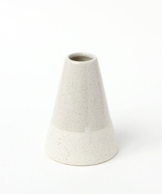 A beige and white bicolored ceramic triangle-shaped vase with a conical top and a flat base.