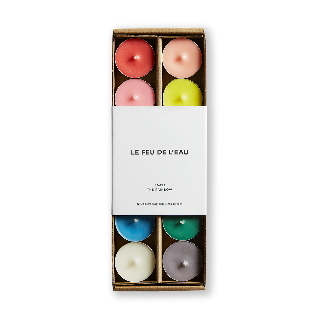 A set of colorful tea lights in a box, with the brand name 'LE FEU DE L'EAU' displayed on the front.