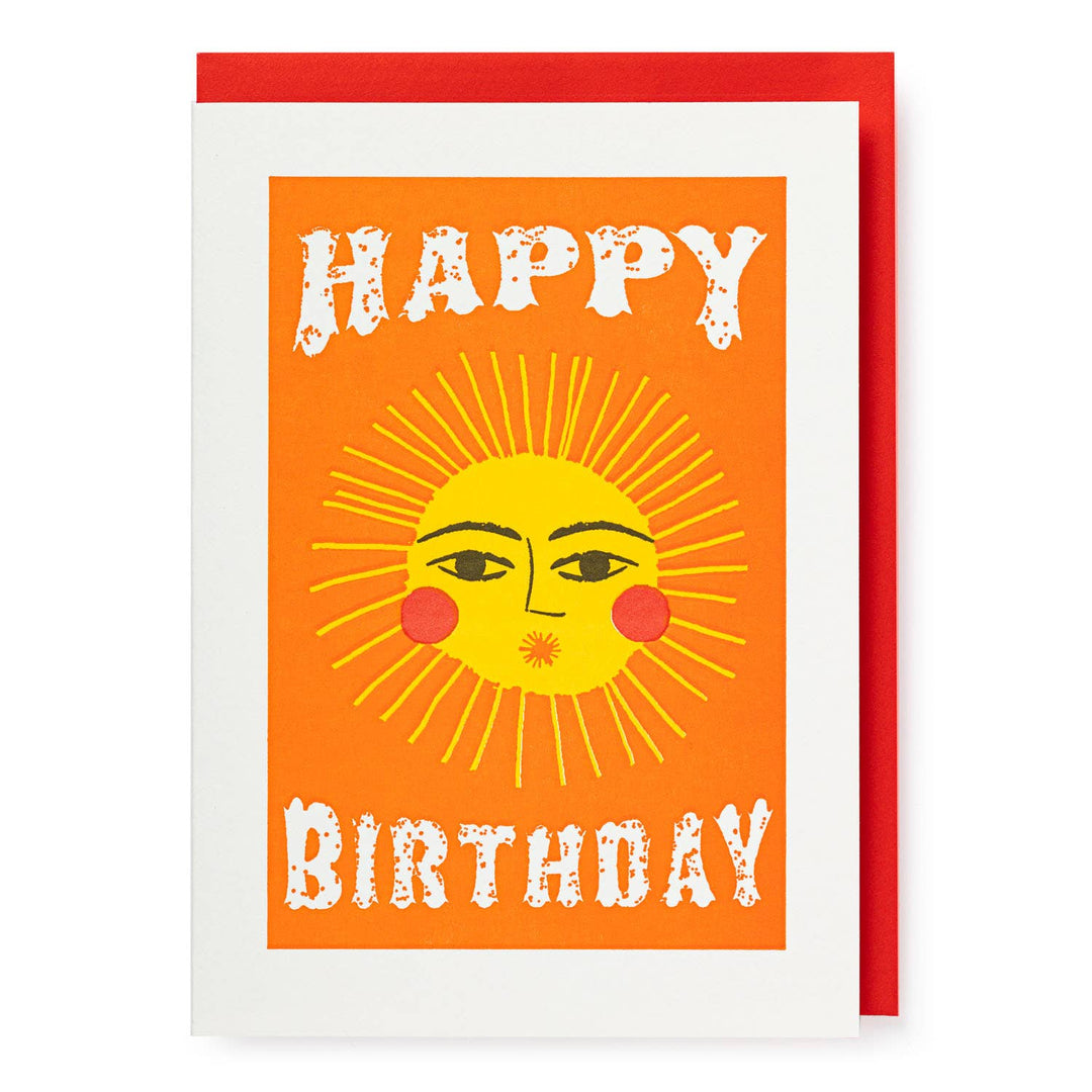 A greeting card with a vibrant illustration of a sun with facial features and the text 'Happy Birthday' in bold letters.