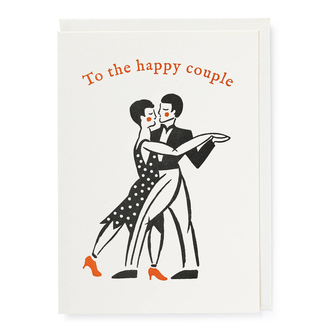 A greeting card with an illustration of a dancing couple. The card is addressed to 'The happy couple' and has a cheerful, elegant design.