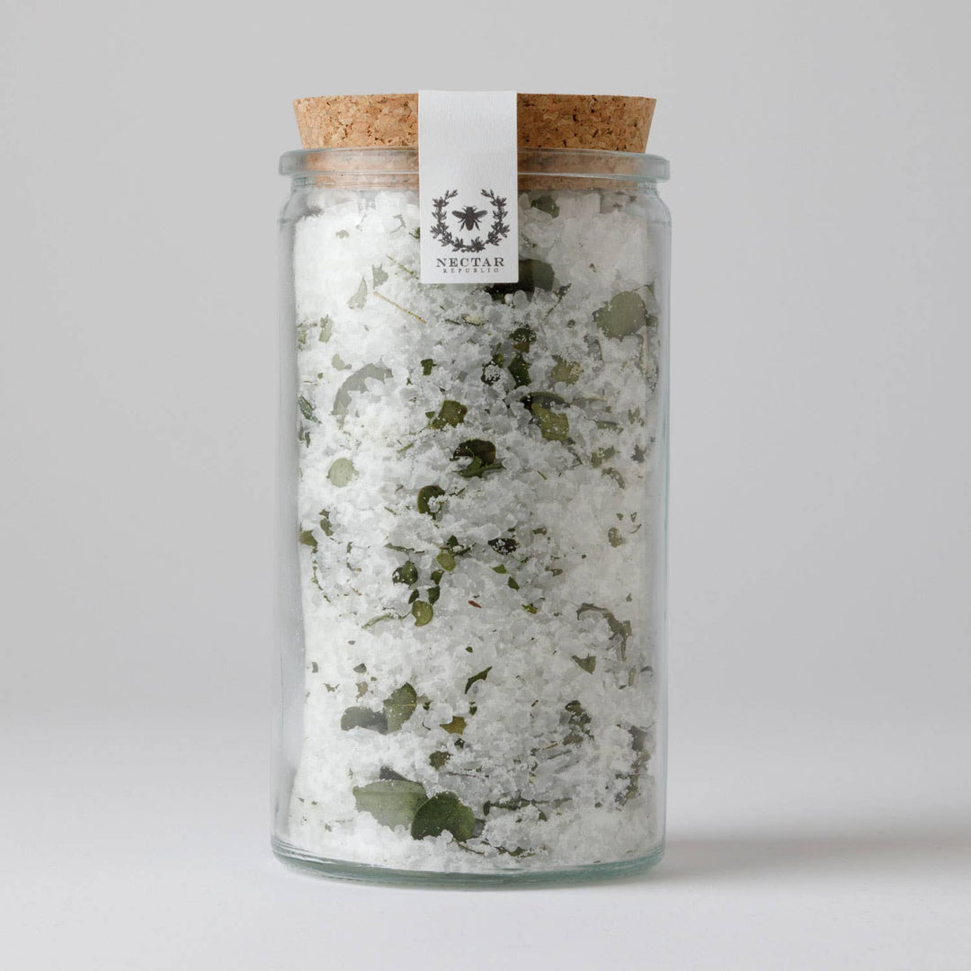 Glass jar with cork lid containing a white and green substance, labeled 'Nectar'.