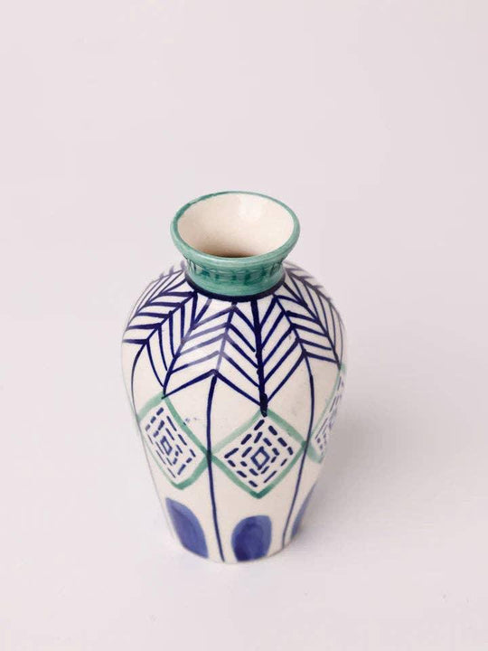 Hand-painted ceramic vase with blue and green geometric patterns, perfect for floral arrangements