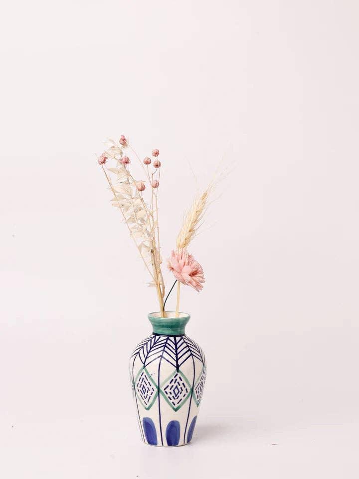 Decorative vase with dried flowers and geometric patterns, perfect for home decor