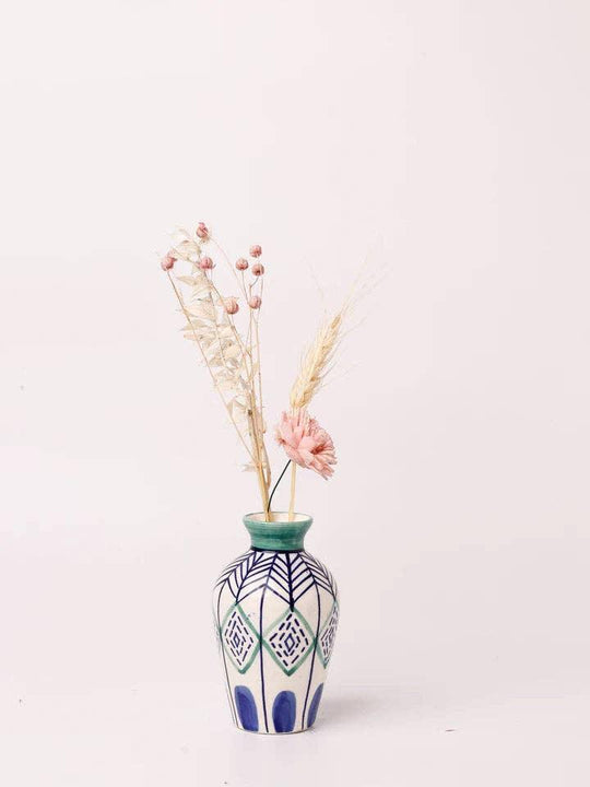 Decorative vase with dried flowers and geometric patterns, perfect for home decor