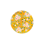 Yellow floral pattern with pink roses and blue berries on a round plate
