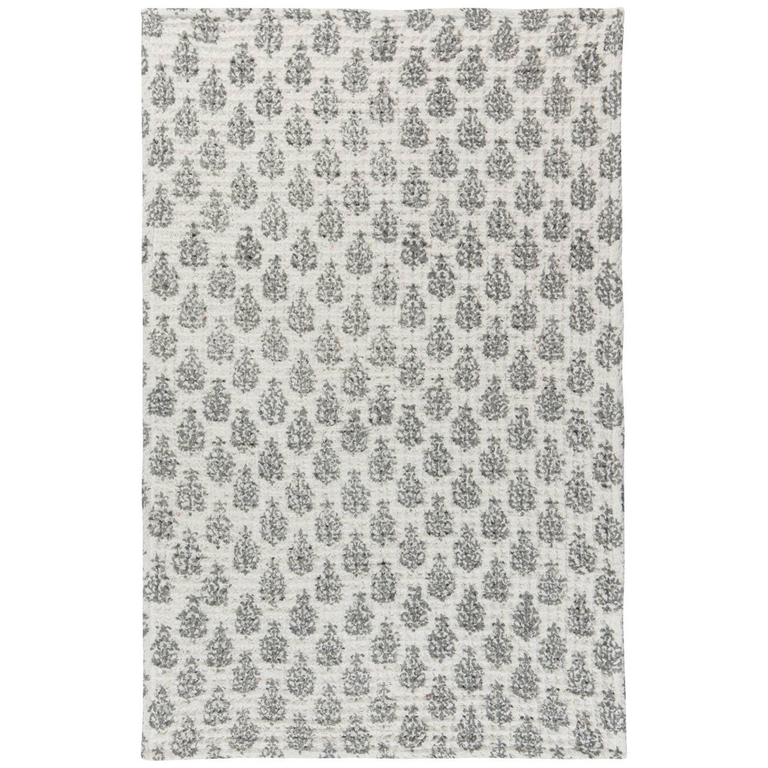 Patterned rug with a floral design on a white background