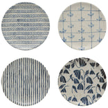 Four circular fabric swatches with blue patterns on a white background