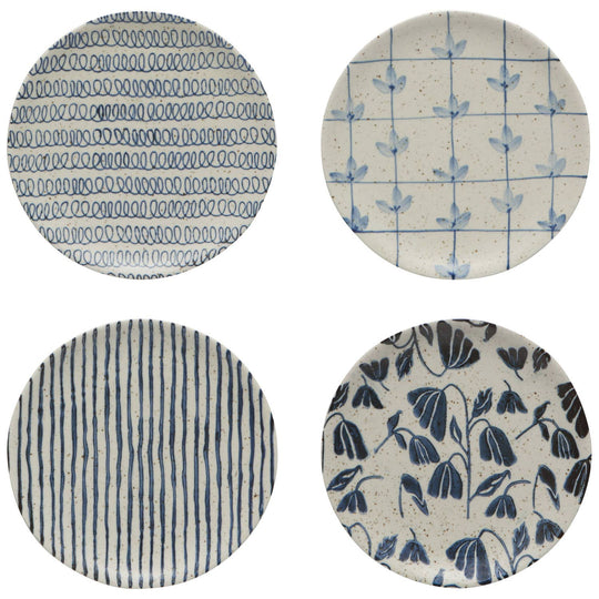 Four circular fabric swatches with blue patterns on a white background