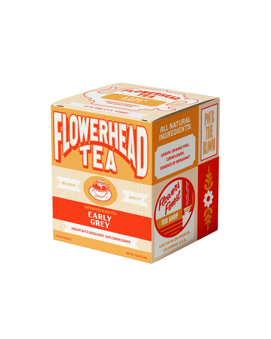 Box of Flowerhead Tea with orange and white design on a white background
