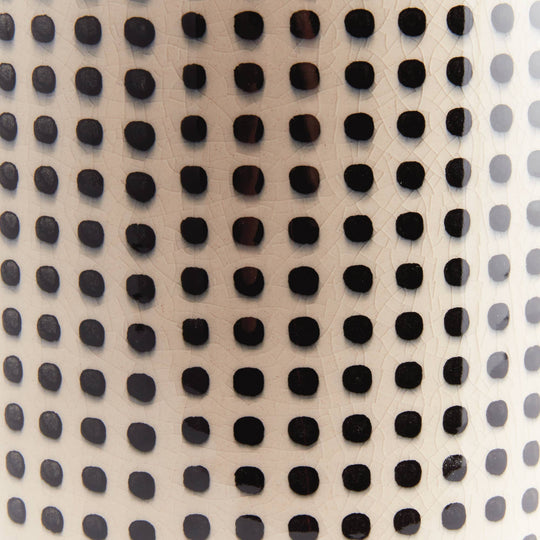 Close-up of a textured surface with black and gray dots