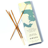 Incense sticks with their packaging featuring a silhouette design on a white background