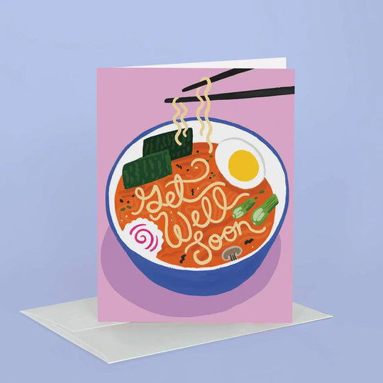 Greeting card with a bowl of ramen and 'Get well soon' text on a pink background