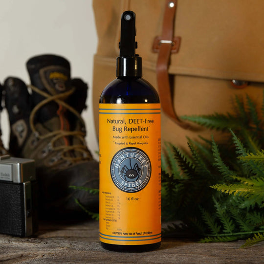 Natural DEET-free bug repellent spray with essential oils, ideal for outdoor adventures