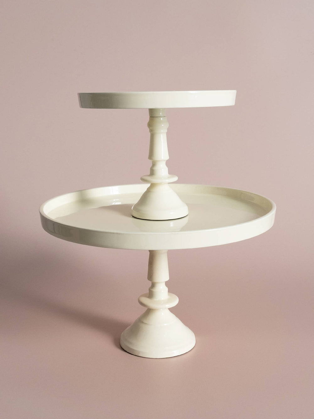 Stacked white cakes stands