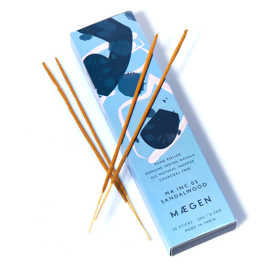 Mégen sandalwood incense sticks with packaging on a white background