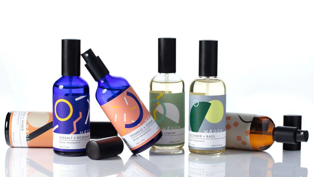 Colorful room fragrance sprays with scents like Seasalt + Rosemary and Cucumber + Basil