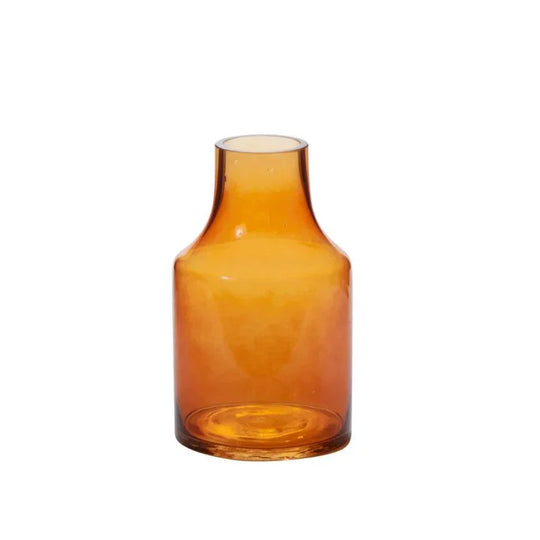 Amber glass vase on a white background