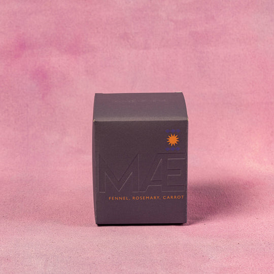 Black box with 'MA' branding on a pink background