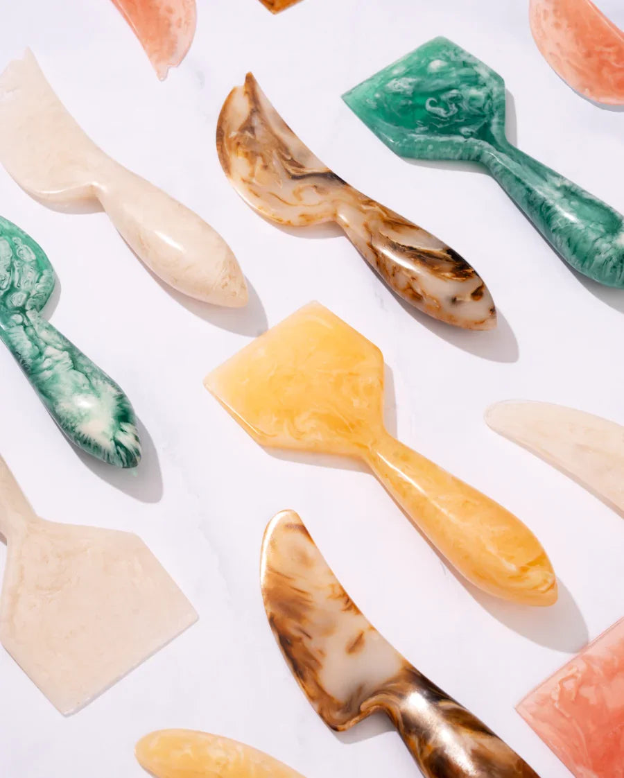 Set of colorful ceramic utensils on a white background