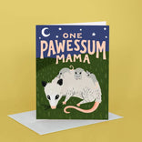 Greeting card with illustration of a mother opossum and her babies, text 'One Pawessum Mama', on a yellow background.