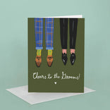 Greeting card with illustration of two pairs of feet and 'Cheers to the Grooms!' text on a green background.
