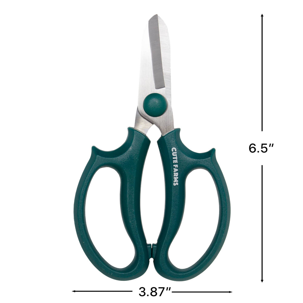 Green-handled scissors with measurements on a white background