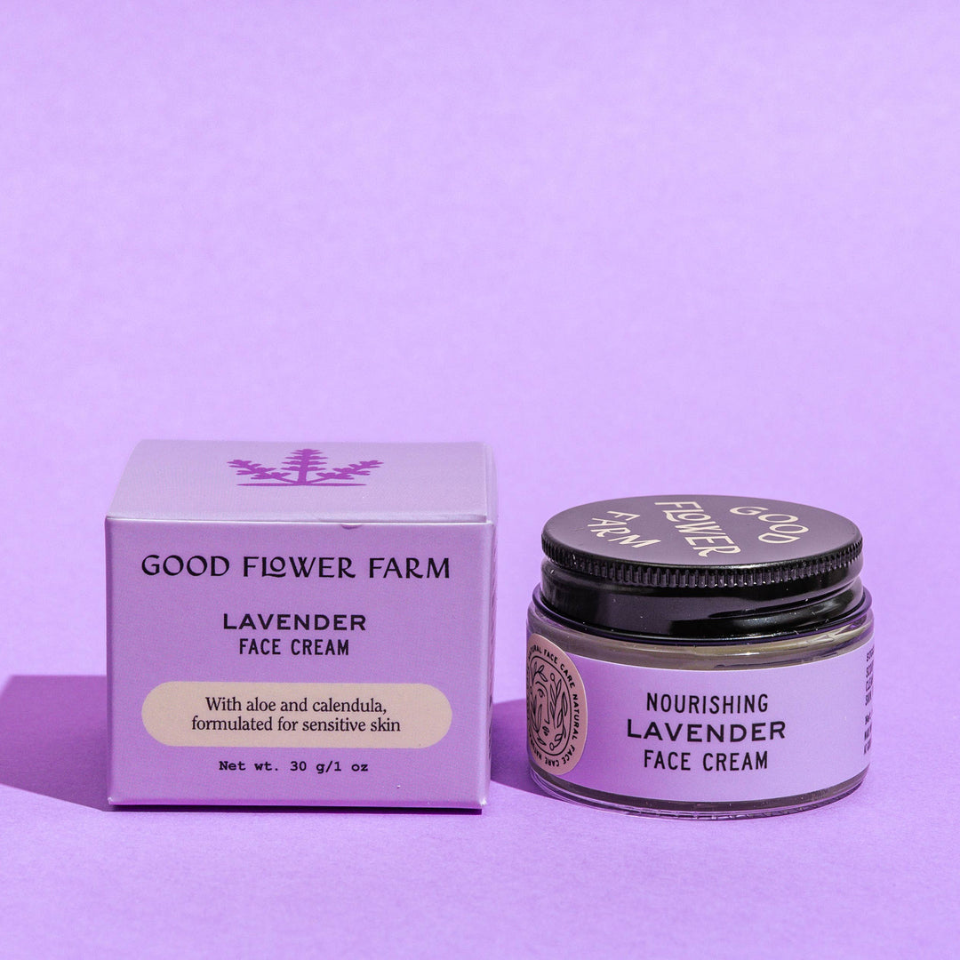 Good Flower Farm lavender face cream jar and box on a purple background