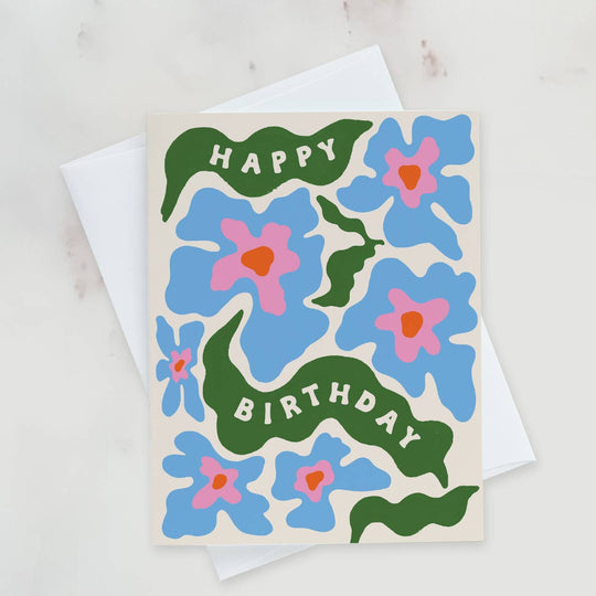 Birthday card with blue flowers and green text on a white background