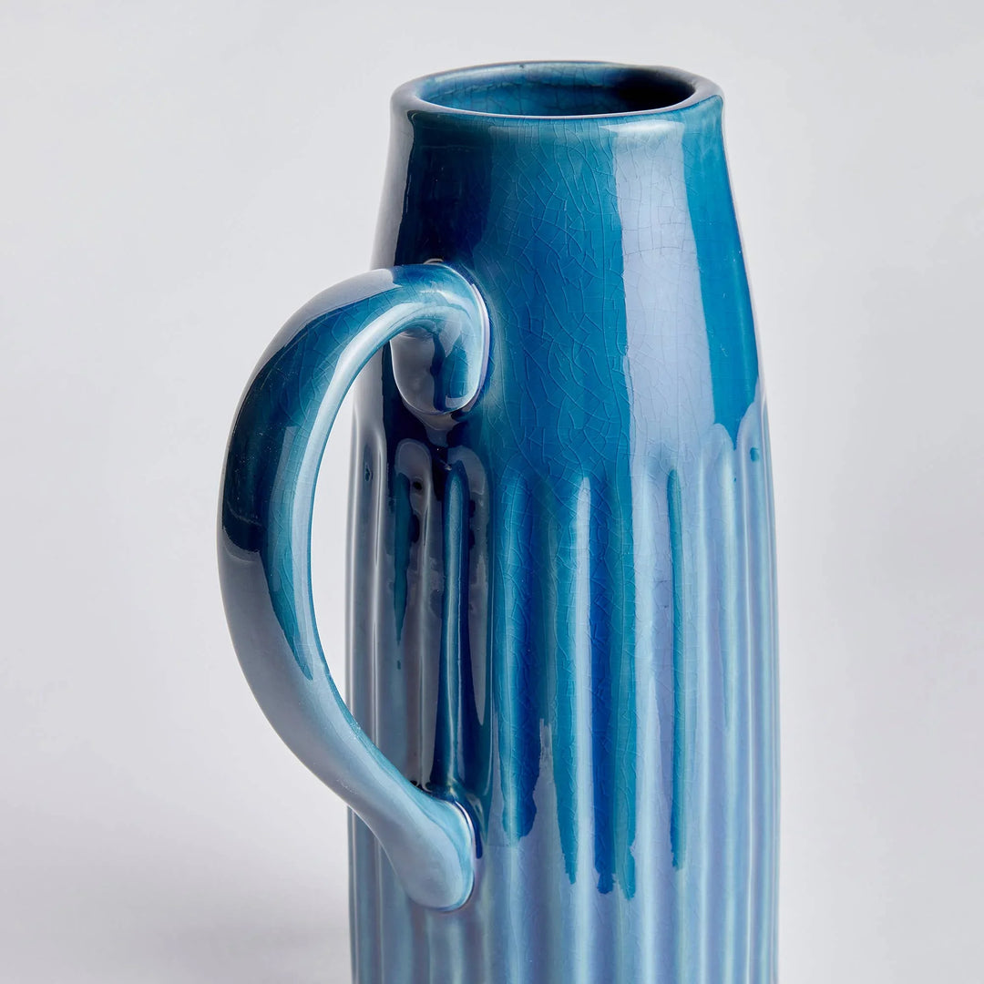 Blue ceramic vase with handle and crackle glaze, perfect for floral arrangements