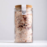 Glass jar with cork lid containing a bath salt mix, branded 'Nectar'.