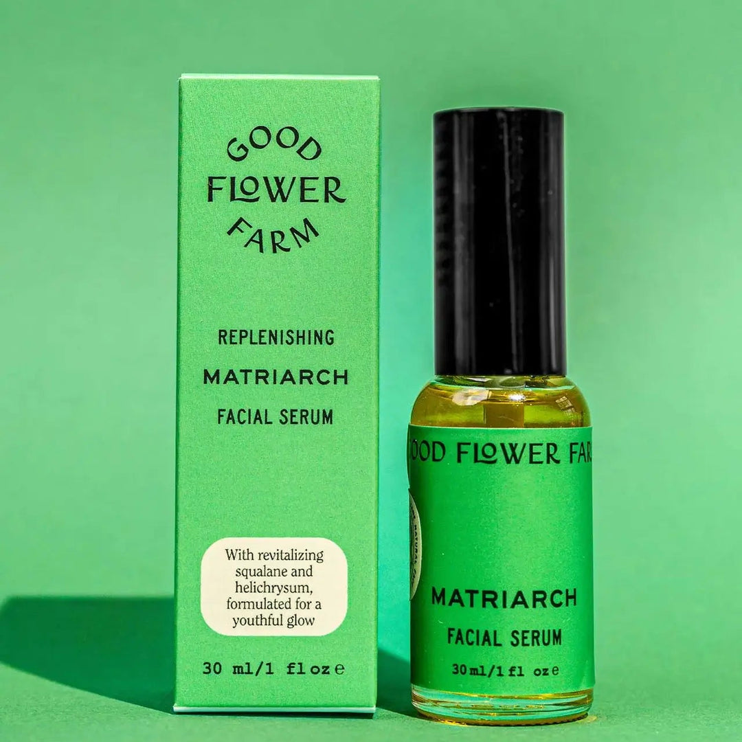Good Flower Farm Matriarch Facial Serum bottle and packaging on a green background