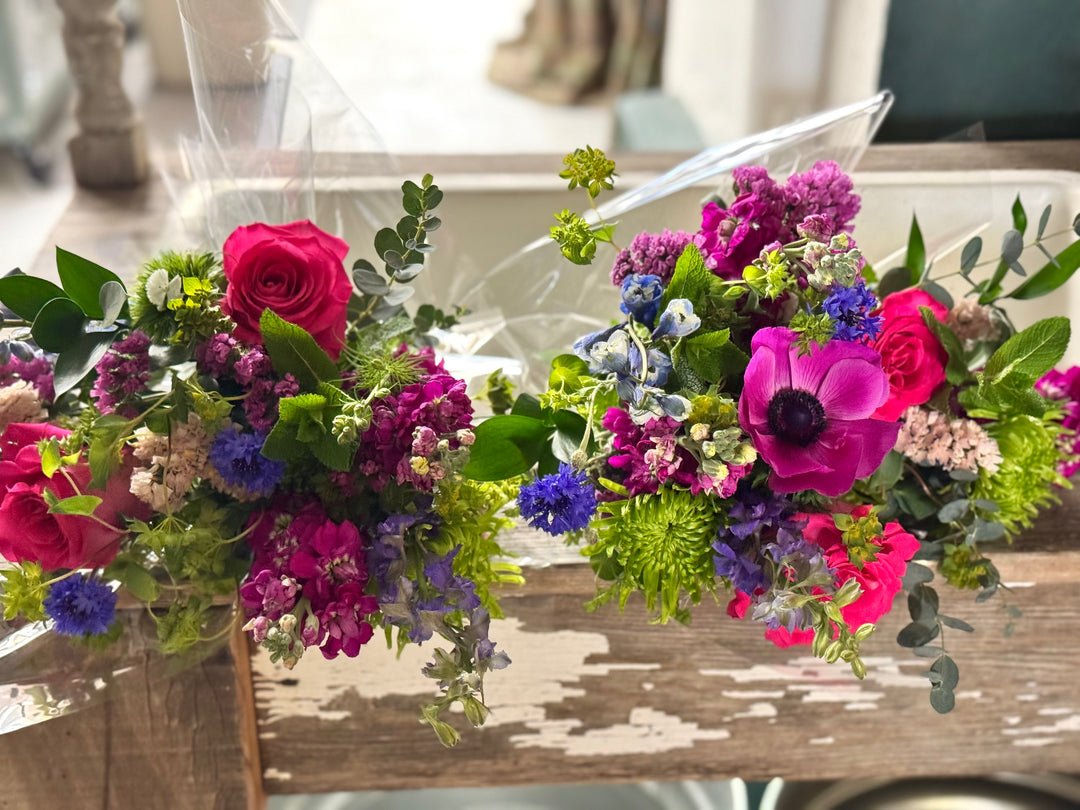 Colorful flower bouquets on a wooden table