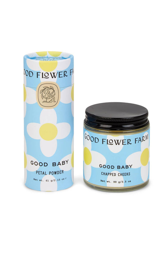 Good Flower Farm baby care products including a jar and a cylindrical container on a white background