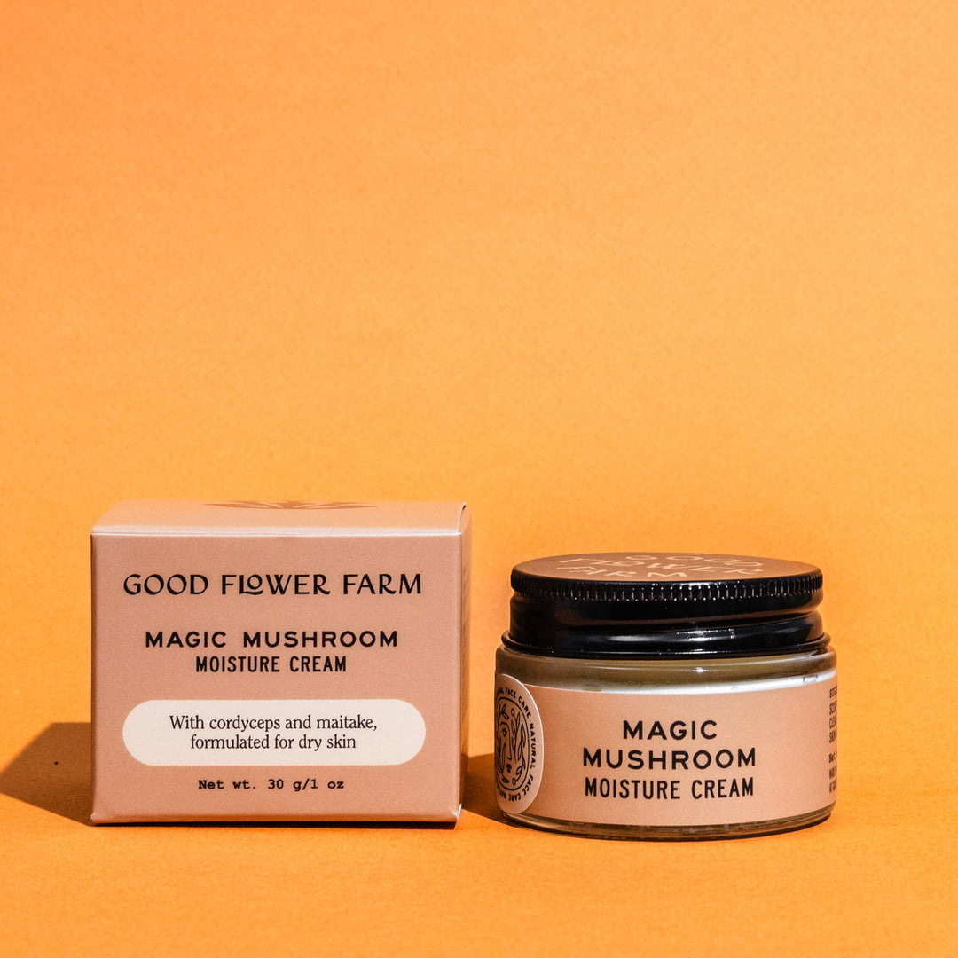 Good Flower Farm Magic Mushroom Moisture Cream jar and box on an orange background