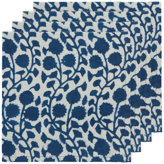 Set of blue floral patterned placemats on a white background