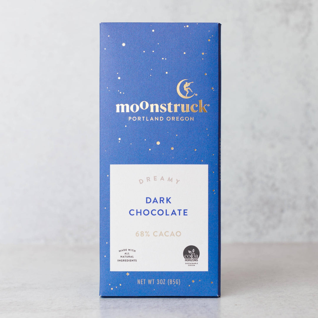 Moonstruck dark chocolate bar packaging on a light gray background