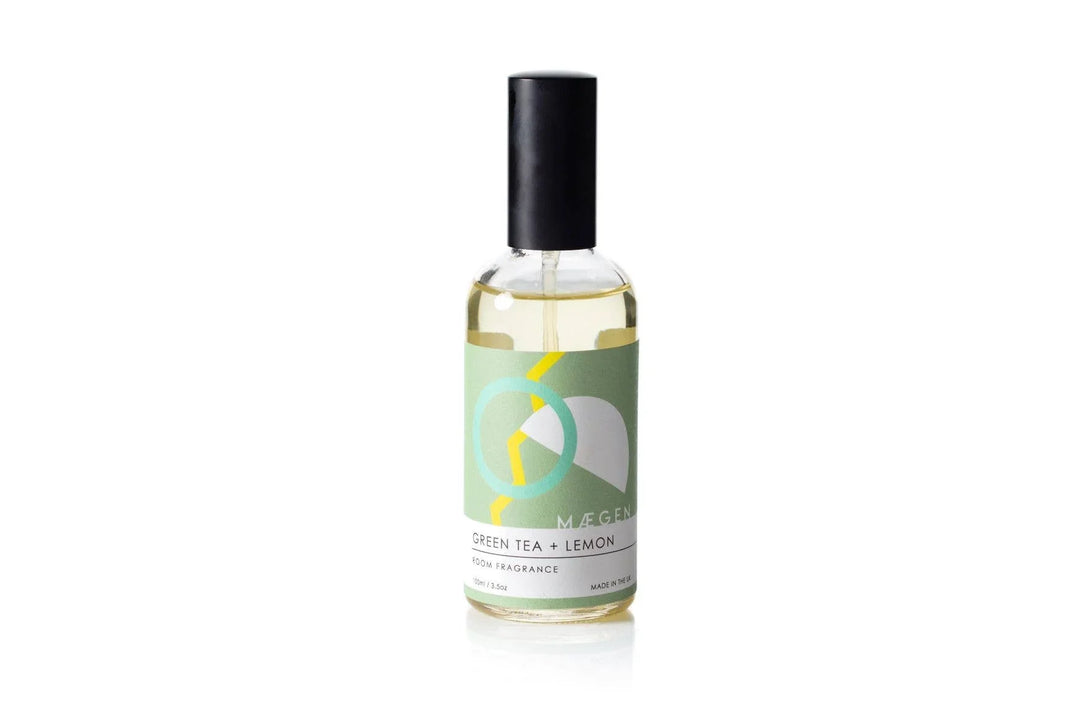 Green Tea + Lemon room fragrance spray in sleek glass bottle with black cap