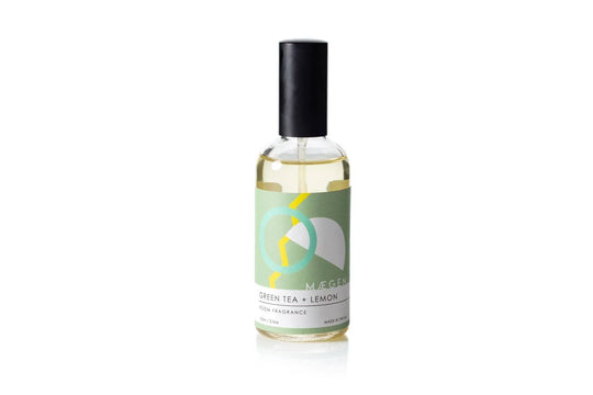 Green Tea + Lemon room fragrance spray in sleek glass bottle with black cap