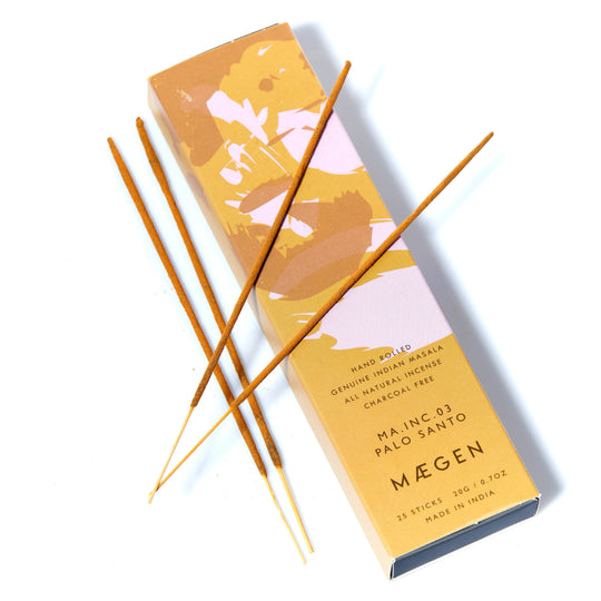 Máegen Palo Santo incense sticks with packaging on a white background