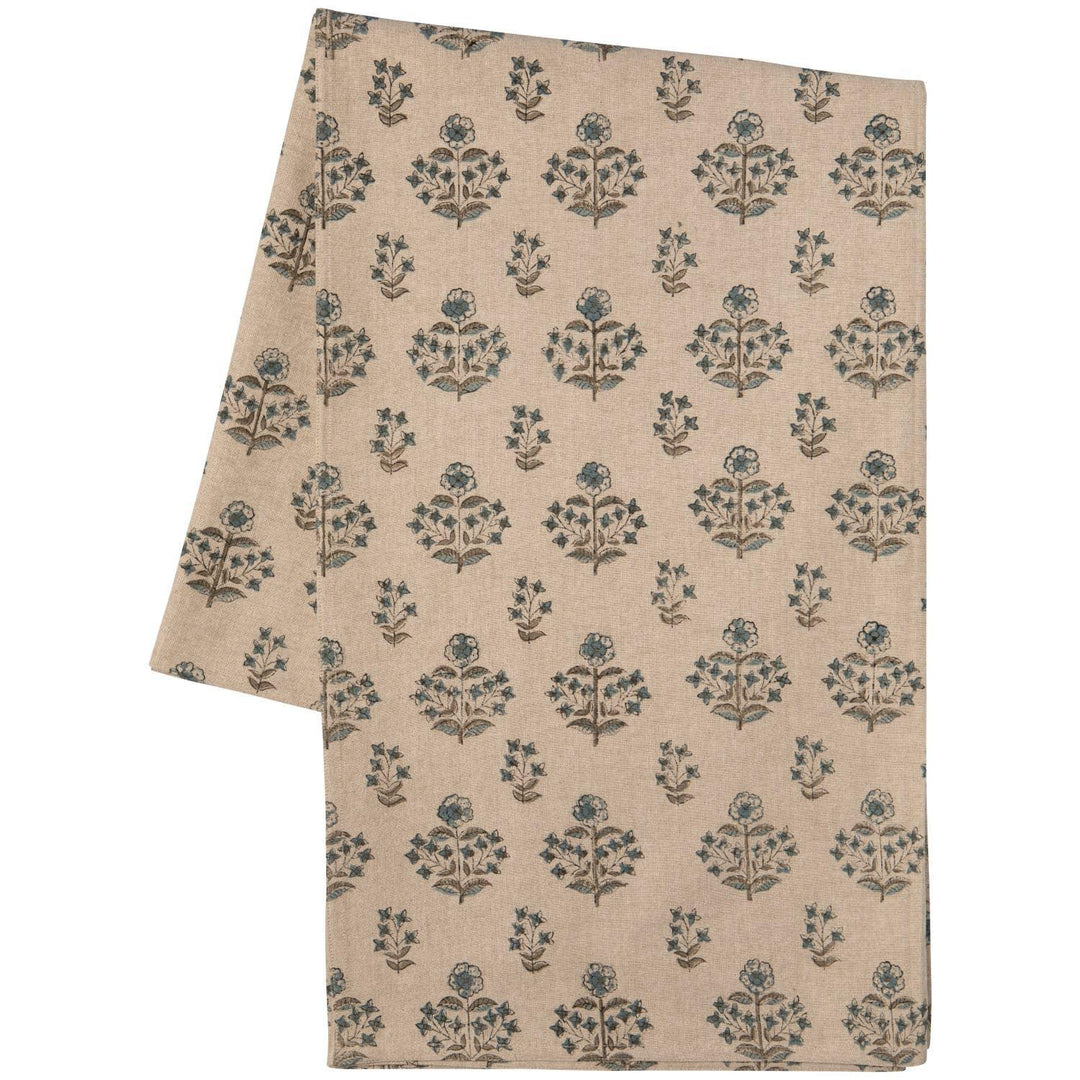Beige fabric with blue floral pattern on a white background