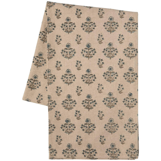Beige fabric with blue floral pattern on a white background