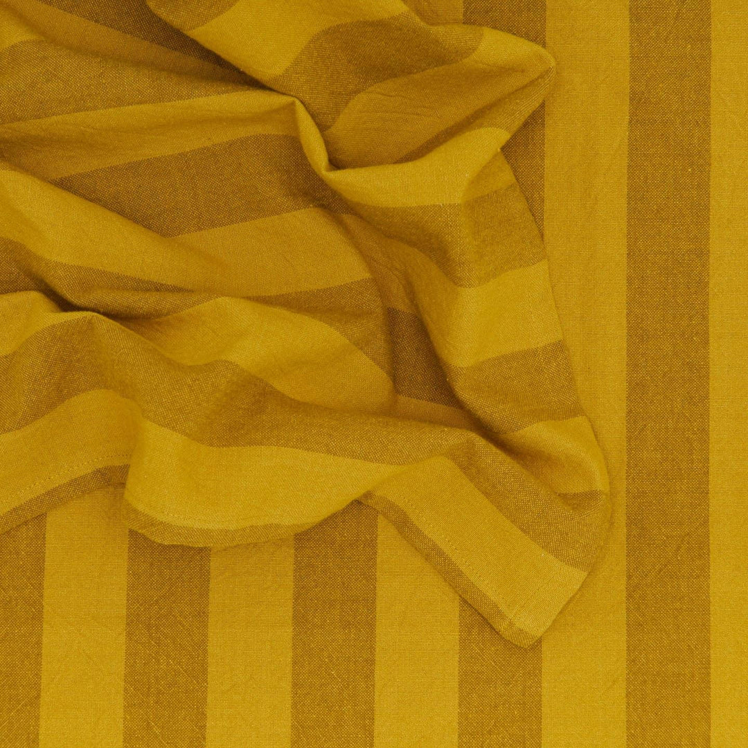 Close-up of yellow and brown striped fabric