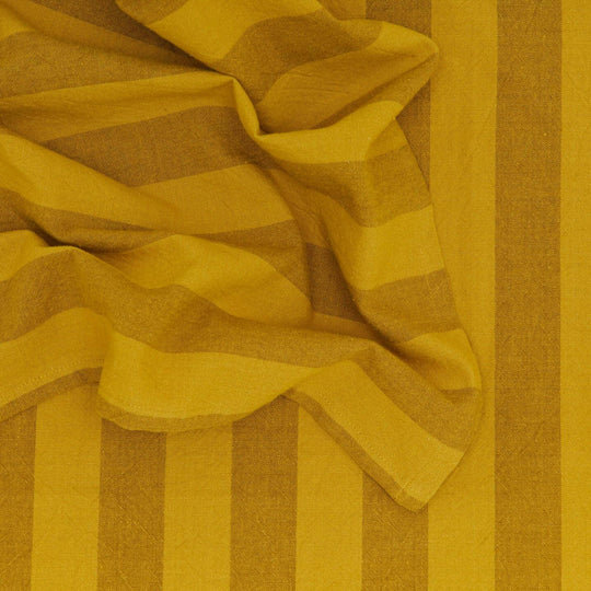 Close-up of yellow and brown striped fabric