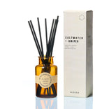 Saltwater + Juniper fragrance diffuser with amber glass bottle and black reeds, UK-made