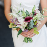 Bouquet held by a person in a white dress