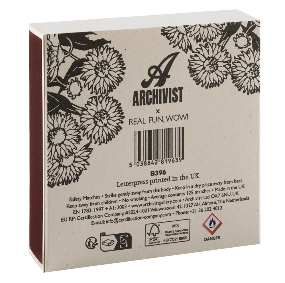 Back of a matchbox package showing floral black-and-white illustration, the Archivist x Real Fun, WOW! branding, a barcode, and printed safety and certification text on a white background.