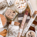 Handcrafted candles, bath salts, and natural soaps with floral accents for self-care and relaxation.