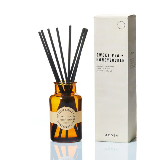 Sweet Pea + Honeysuckle fragrance diffuser in amber glass with black reeds, UK-poured