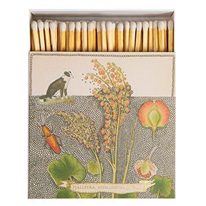 A picture of a collie dog and orange and green flowers on a cream background.