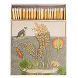 A picture of a collie dog and orange and green flowers on a cream background.